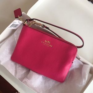 COACH pink wristlet